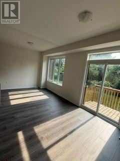 Kawartha Lakes (Lindsay) townhouse for rent - A room with a sliding glass door leading to a balcony.