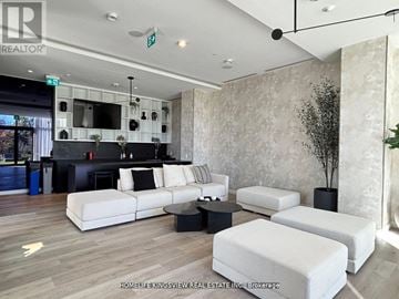 Mississauga (Cooksville) condo for rent - A living room with a white couch and a black coffee table.