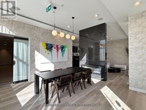 Mississauga (Cooksville) condo for rent - A modern dining room with a black table and chairs.