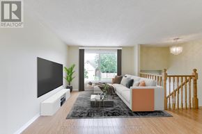 Cambridge apartment for rent - A living room with a television, couch, and a plant.