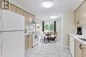 Cambridge apartment for rent - A kitchen with white appliances and wooden cabinets.