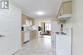 Cambridge apartment for rent - A kitchen with white appliances and a white refrigerator.