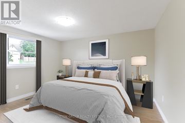 Cambridge apartment for rent - A bedroom with a large bed and a flat screen TV mounted on the wall.