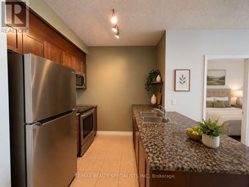 Mississauga (Fairview) condo for rent - A kitchen with a granite counter top and stainless steel appliances.