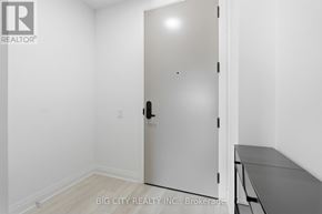 Toronto (Thorncliffe Park) condo for rent - A white door with a black handle in a room with white walls.
