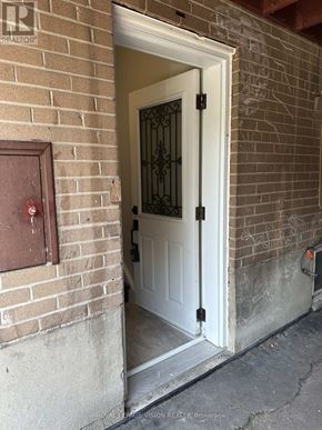 Toronto (Woburn) apartment for rent - A white door with a black handle is open.