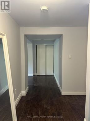 Toronto (Woburn) apartment for rent - A hallway with wood floors and white walls.