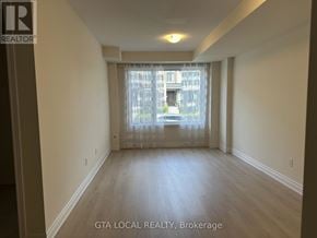 Vaughan (Patterson) townhouse for rent - A room with a window and a view of a building outside.