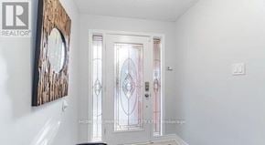 Brampton (Northwood Park) apartment for rent - A white door with a glass window and a wooden frame.
