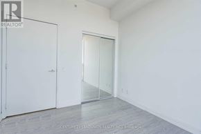 Toronto (Moss Park) condo for rent - A room with a white door and a glass door.