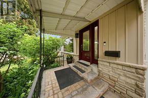 Mississauga (Applewood) apartment for rent - A house entrance with a red door and a stone wall.