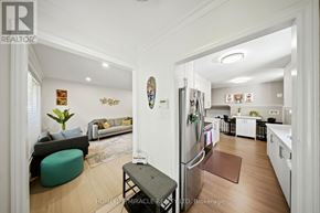 Mississauga (Applewood) apartment for rent - A modern kitchen and living room are shown in this image.