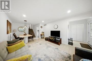 Mississauga (Applewood) apartment for rent - A living room with a grey couch and a white wall.
