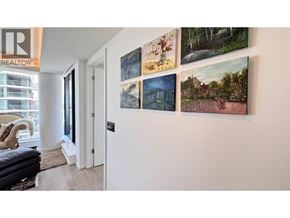 Vancouver apartment for rent - A living room with a couch and a wall with pictures.