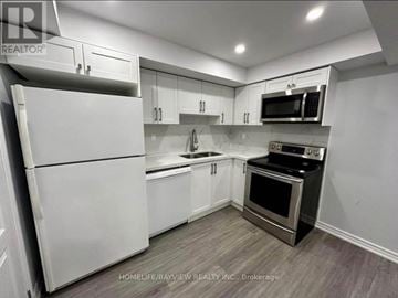 Newmarket (Summerhill Estates) townhouse for rent - A kitchen with white appliances and cabinets.