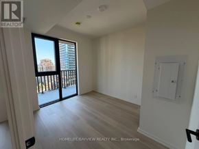 Toronto (Mount Pleasant West) condo for rent - A room with a sliding glass door leading to a balcony.