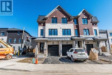 Mississauga (East Credit) townhouse for rent - A large, multi-story house with a car parked in front.