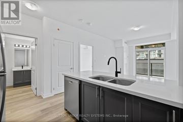 Hamilton (Waterdown) condo for rent - A modern kitchen with a sink and cabinets.