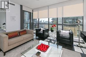 Toronto (Waterfront Communities) condo for rent - A living room with a couch, chair, and coffee table.