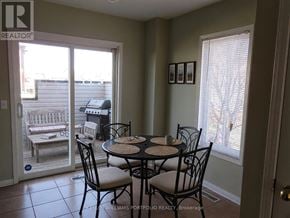 Toronto (Rouge) townhouse for rent - A dining room with a table set for four.