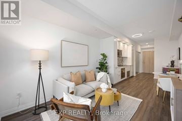 Toronto (Willowdale West) condo for rent - A well-lit living room with a white sofa and a wooden coffee table.