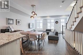 Toronto (Long Branch) townhouse for rent - A modern dining room with a table set for four.
