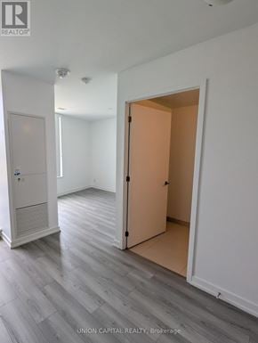 Toronto (Downsview-Roding-Cfb) condo for rent - A room with a white door and a brown door.