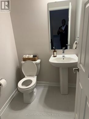 Ottawa townhouse for rent - A man is reflected in a bathroom mirror.