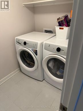 Ottawa townhouse for rent - Two front loading washing machines in a laundry room.