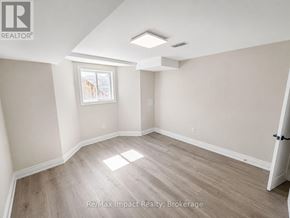 Oshawa (Taunton) apartment for rent - A room with a window and a door is for rent.