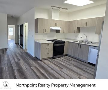 Langley apartment for rent - A kitchen with a stove top oven and a dishwasher.