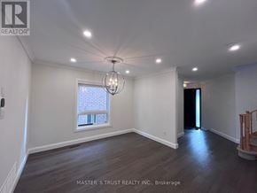 Richmond Hill (Westbrook) apartment for rent - A room with a window and a chandelier hanging from the ceiling.