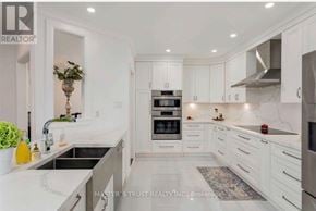 Richmond Hill (Westbrook) apartment for rent - A modern kitchen with white cabinets and stainless steel appliances.