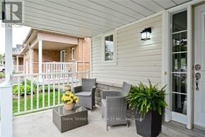 Whitby (Brooklin) townhouse for rent - A patio with a table, chairs and potted plants.