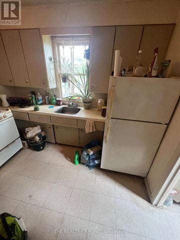 London East (East F) fourplex for rent - A kitchen with a sink and a window.