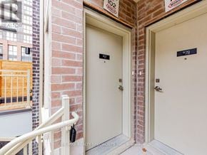 Vaughan (Vaughan Corporate Centre) townhouse for rent - Two doors with numbers 77 and 78 on them.