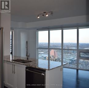 Mississauga (City Centre) condo for rent - A kitchen with a view of the city.