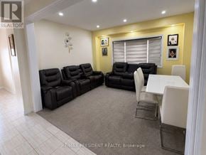 Southgate apartment for rent - A living room with a black couch and a white table.