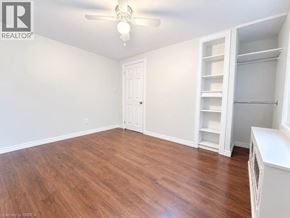 Brantford apartment for rent - A room with a wooden floor and white walls.