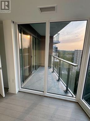 Toronto (Humber Heights) condo for rent - A glass door with a balcony outside.