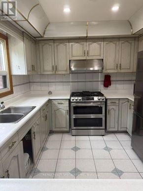 Brampton (Northgate) apartment for rent - A kitchen with a stove top oven and a sink.