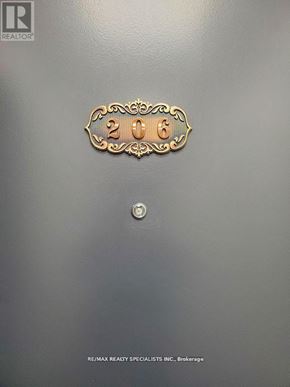 Hamilton (Beasley) condo for rent - A metal plate with the number 2006 and the logo of a realtor.