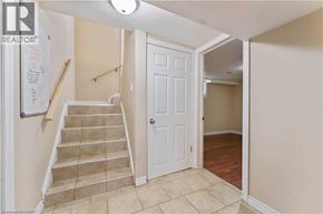 Hamilton apartment for rent - A hallway with a staircase leading to the second floor.