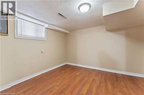 Hamilton apartment for rent - A room with wooden flooring and a window with blinds.