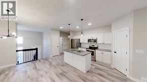 Grande Prairie apartment for rent - A spacious kitchen with a large island in the middle.