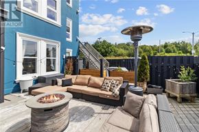 St. John's apartment for rent - A patio with a fire pit and seating area.