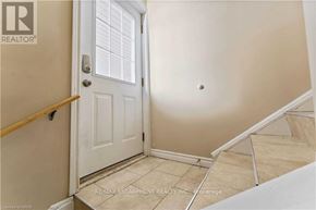 Hamilton (Berrisfield) apartment for rent - A white door is in a room with a wooden banister.
