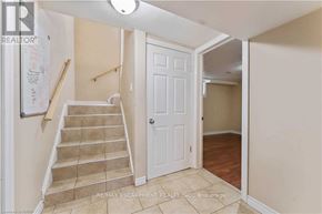 Hamilton (Berrisfield) apartment for rent - A hallway with a staircase leading to the second floor.