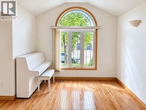 Windsor apartment for rent - A room with a white piano and wooden floors.