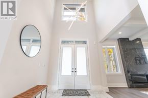 Burlington (Roseland) apartment for rent - A foyer with a bench, a mirror, and a door.